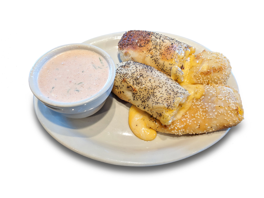 <p>Hand twisted bread sticks stuffed with cheddar and pepper jack cheese and studded with poppy and sesame seeds. Served with your choice of 1 sauce.</p>